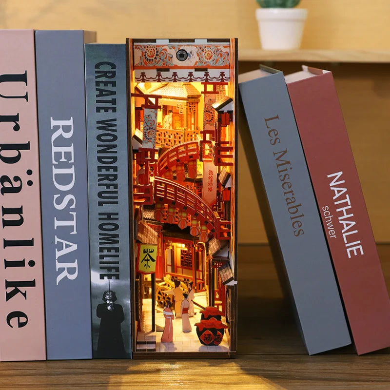 Miniature Japanese tavern book nook between books