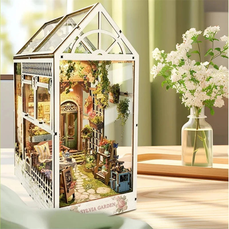 Side view of garden greenhouse book nook with flowers