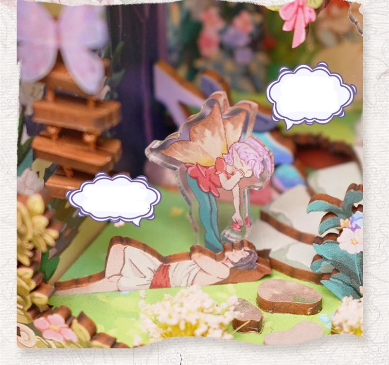 Close-up of fairy figures in book nook