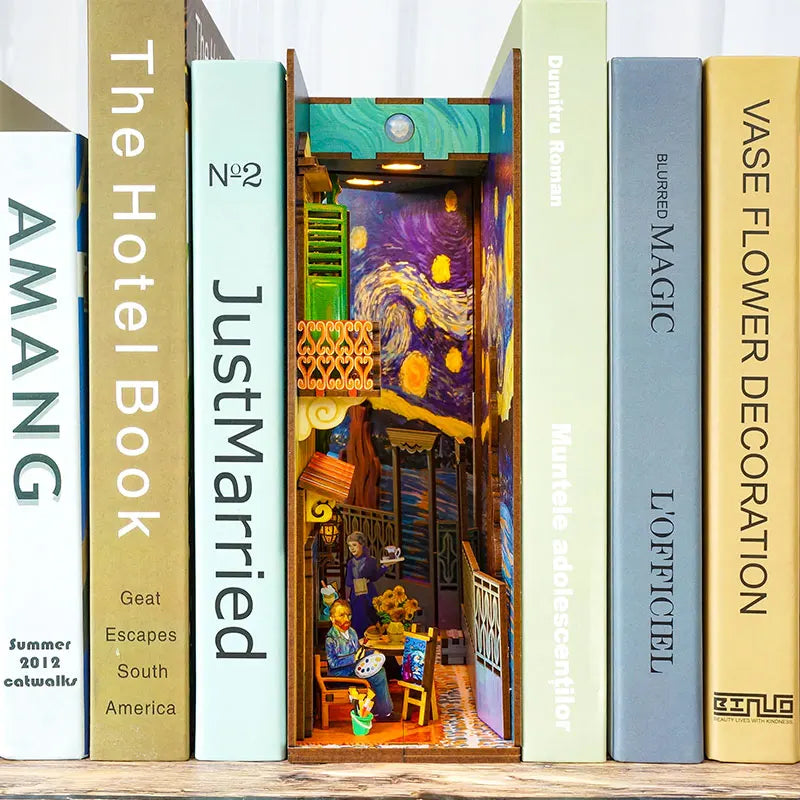 Book nook kit with Van Gogh theme placed between books