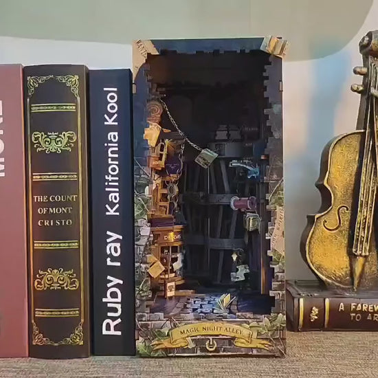 Magic Alley Book Nook Kit displayed with books and violin decor