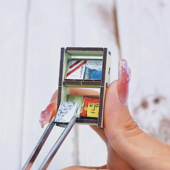 Close-up of miniature bookshelf assembly in book nook kit