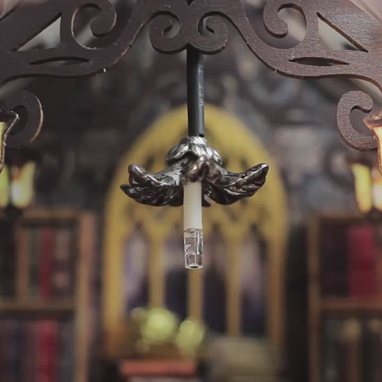 Close-up of intricate chandelier in book nook