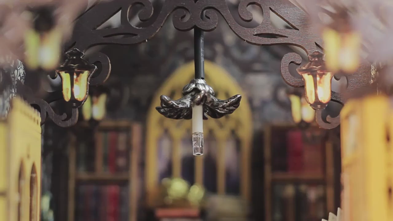 Close-up of intricate chandelier in book nook